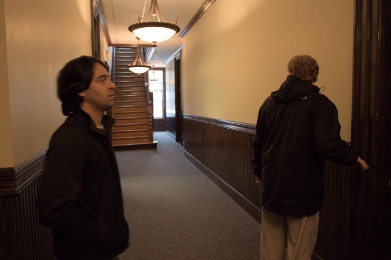 chris and a realtor look at potential office location