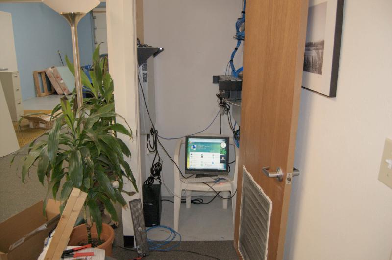 office network and compute closet with some 2U servers, a monitor, network switch and network gateway