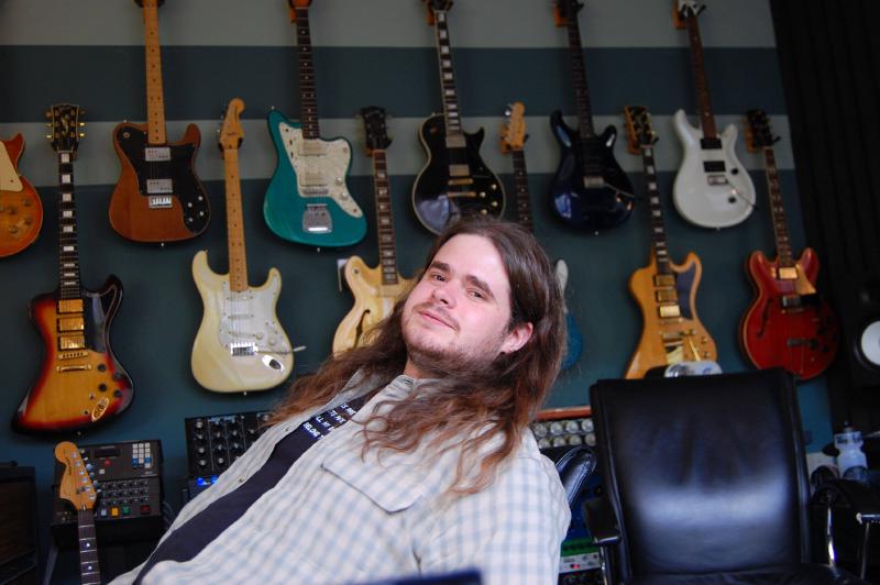 nick enjoying the wall of guitars in taylor&rsquo;s music studio after programming camp