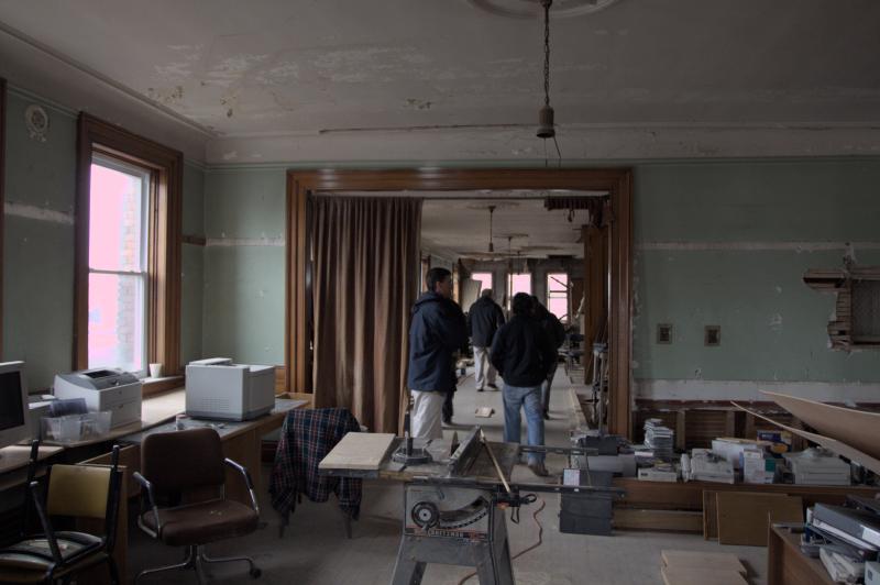 chris, matt and realtors tour a gross property