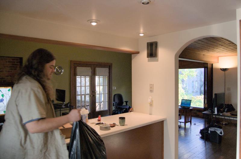nick cleaning up kitchen in willett house after we moved in