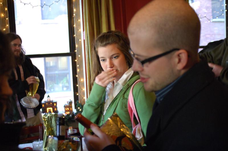 nick cosimano, miranda sehl, kevin holmes looking at wine