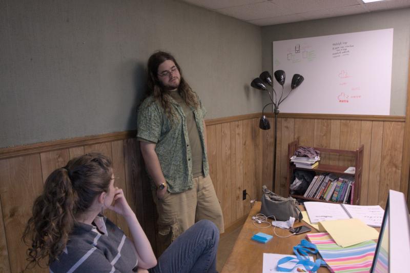 nick and miranda talking in office