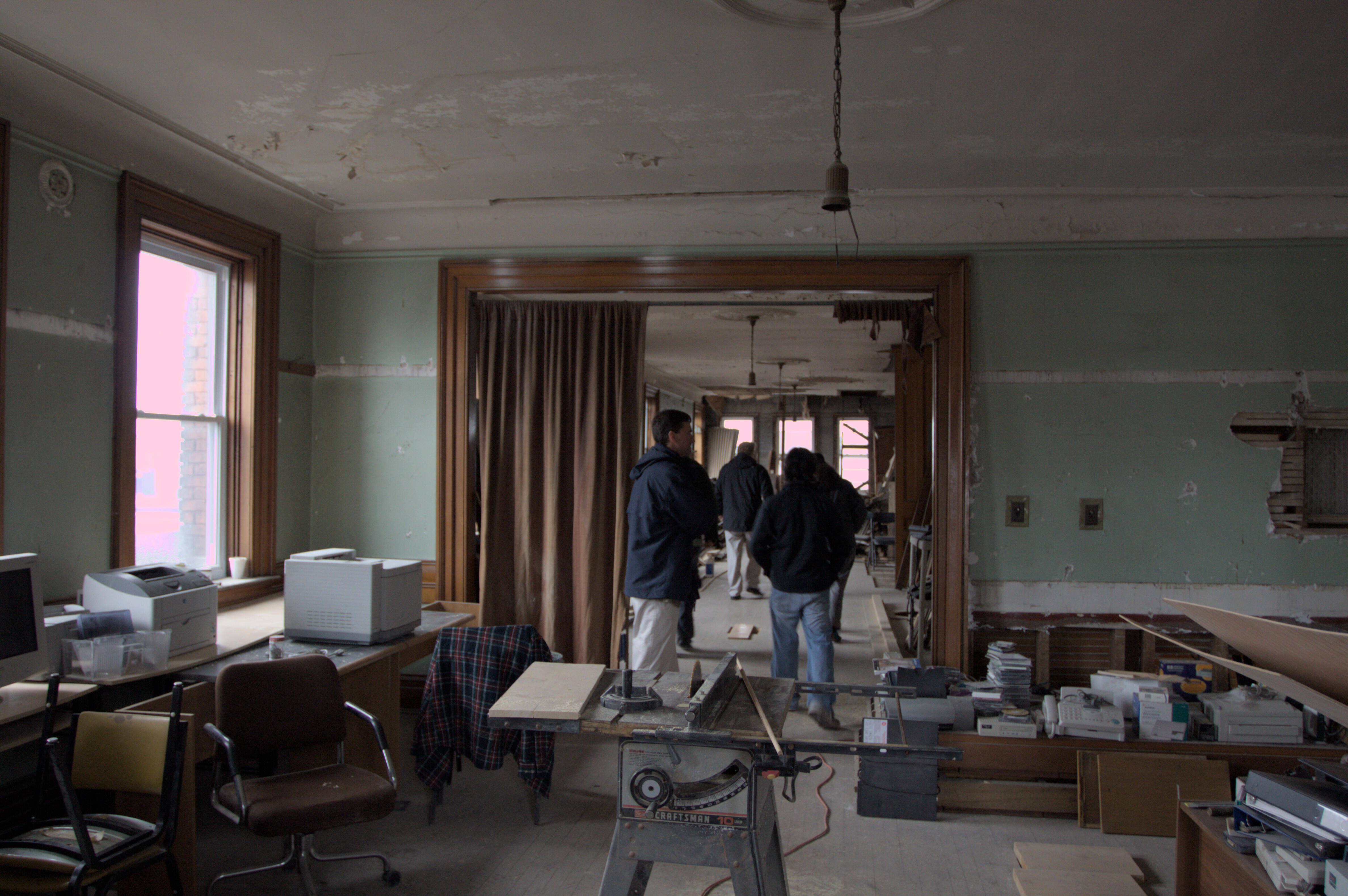 chris, matt and realtors tour a gross property