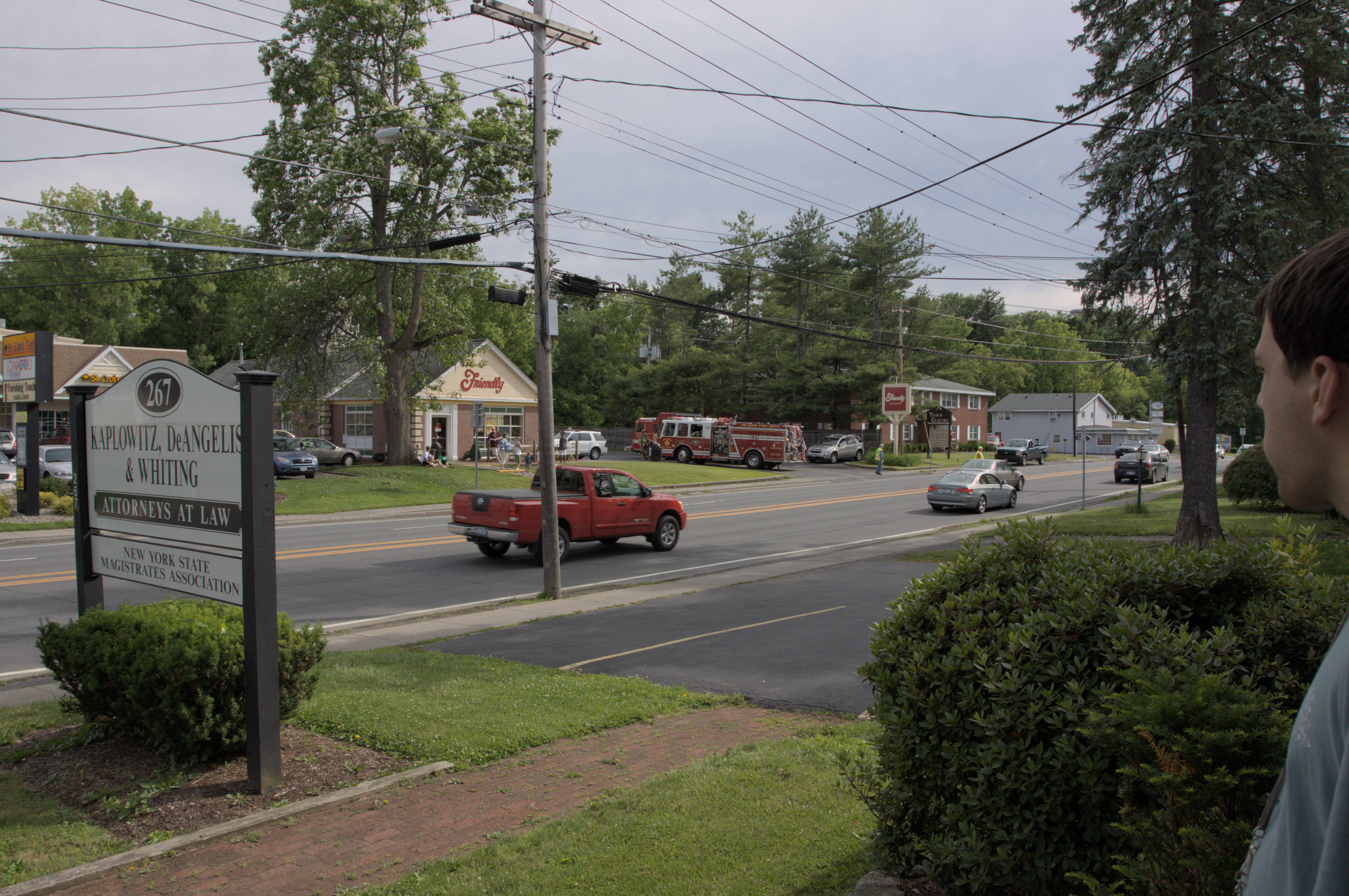 front of delaware ave office looking out to street with Jeff and fire trucks at friendly’s resturant